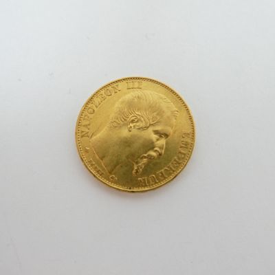 a gold coin with a picture of a man on it