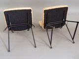 two chairs that are sitting next to each other
