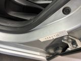 a close up of a car door handle with a sticker on it