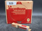 a box of red toothpaste next to a tube of toothpaste