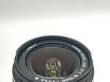 a close up of a camera lens on a white surface