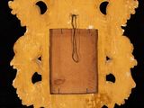 an image of a wooden frame with a picture hanging on it