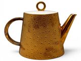 an image of a gold teapot on a white background