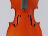 an orange violin with a black bow on a white background