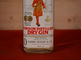 a bottle of dry gin sitting on a table