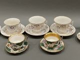 a lot of cups and saucers on the table