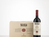 a bottle of red wine next to a cardboard box
