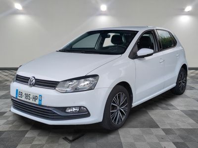a white volkswagen polo estate parked on a checkered floor