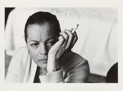 black and white photograph of a woman with a cigarette in her hand