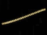 yellow gold tennis bracelet with diamonds on a black background