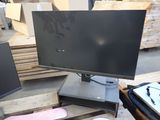 a computer monitor sitting on top of a wooden pallet