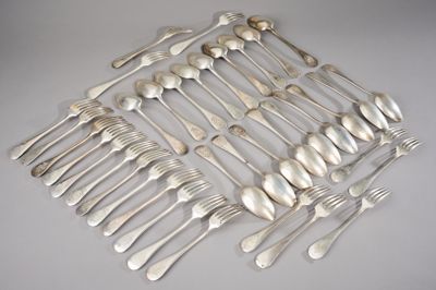 a lot of silver spoons and forks on the table