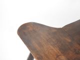 a close up of a wooden chair on a white background