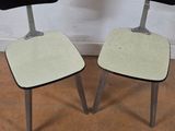 two chairs that are sitting next to each other on the floor
