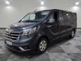 a picture of a grey van parked in a garage