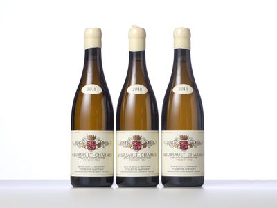 three bottles of wine sitting on top of a table