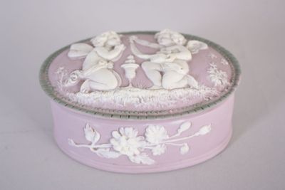 a pink box with a picture of angels on it