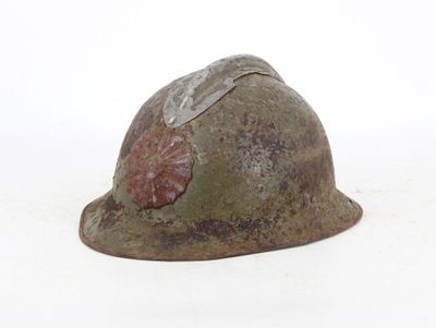 a helmet with a shell on it on a white surface