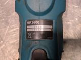 a close up of a blue electric drill on a table