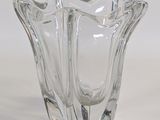 a glass vase that is sitting on a table
