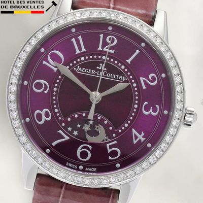 a close up of a purple watch with diamonds on it