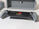 a video game controller and a box on a table