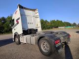 a semi truck that is parked on the side of the road