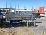 an image of a flatbed trailer parked in a lot