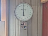 a clock that is hanging on the wall of a building