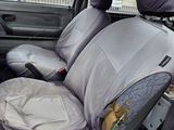 a car that has a seat cover on the back of it