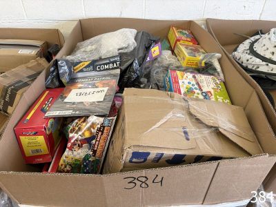 a cardboard box filled with assorted items on a table