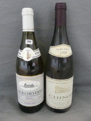 two bottles of wine sitting next to each other on a table