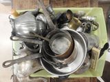 many pots and pans that are sitting on a table