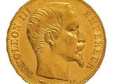 a close up of a gold coin with a man ' s face on it