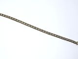 a silver bracelet with a chain attached to it