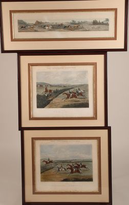 three framed pictures of horses and jockeys racing in a field