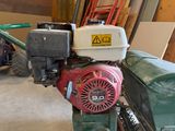 a small engine that is sitting in a garage