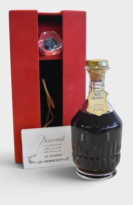 a bottle of liquor sitting next to a red box