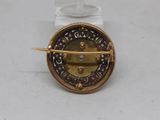 an image of a gold and diamond broochle
