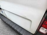 a white van parked on the side of the road