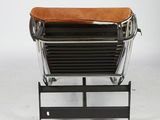 a leather and steel lounge chair from the early 20th century