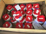 many buckets of red and white containers in a box