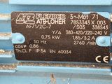 an image of a blue machine with a sign on it