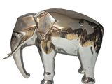 a silver elephant that is standing on a white surface