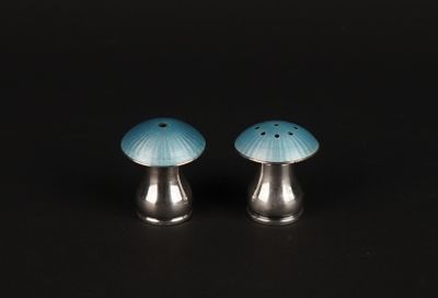 pair of salt and pepper shakers in the shape of a mushroom