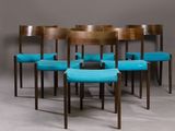 six chairs with blue upholstered seats are arranged in a circle