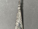 a close up of a spoon with a handle on a table