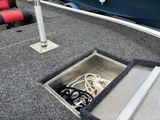 a boat that has a sink in the middle of it