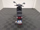 a motor scooter that is parked in a room