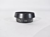a close up of a camera lens on a white surface